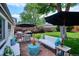 Serene backyard patio with a cozy seating arrangement, ideal for enjoying warm days and pleasant evenings at 225 N Ivanhoe St, Denver, CO 80220