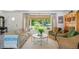 Bright living room featuring stylish furnishings, a large window, and lots of natural light at 225 N Ivanhoe St, Denver, CO 80220