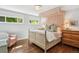 Sunlit main bedroom with hardwood floors, natural light, and stylish furnishings at 225 N Ivanhoe St, Denver, CO 80220