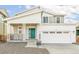 Traditional two-story home featuring a spacious two-car garage and inviting covered porch at 9303 Biscay St, Commerce City, CO 80022