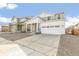 Charming two-story home with a two car garage and a well-maintained front yard and cozy front porch at 9303 Biscay St, Commerce City, CO 80022