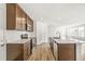Stylish kitchen with quartz countertops, stainless steel appliances, and a large island at 9303 Biscay St, Commerce City, CO 80022