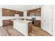 Bright kitchen with stainless appliances, quartz countertops, and a large island at 9303 Biscay St, Commerce City, CO 80022