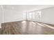 Bright living room featuring beautiful hardwood floors and ample natural light at 9303 Biscay St, Commerce City, CO 80022