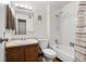 Functional bathroom featuring a vanity with storage, toilet, and a shower-tub combination at 1792 S Pitkin Cir # B, Aurora, CO 80017