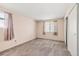 Spacious bedroom features soft carpeting and a bright window at 1792 S Pitkin Cir # B, Aurora, CO 80017