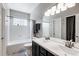 Bathroom with double sink vanity, tub and shower combination at 6825 S Webster St # A, Littleton, CO 80128