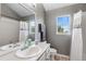 Bathroom featuring a large mirror and plenty of natural light at 6825 S Webster St # A, Littleton, CO 80128