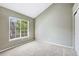 Empty bedroom features a large window with natural lighting at 6825 S Webster St # A, Littleton, CO 80128