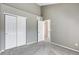 Empty bedroom features a neutral carpet, closet and paint at 6825 S Webster St # A, Littleton, CO 80128