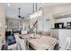 Dining room with wooden table and chairs near the living room and kitchen at 6825 S Webster St # A, Littleton, CO 80128