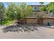 Townhome boasts brick accents, attached two-car garage and mature landscaping at 6825 S Webster St # A, Littleton, CO 80128