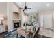 Bright living room showcasing fireplace, vaulted ceiling, and comfortable furnishings at 6825 S Webster St # A, Littleton, CO 80128