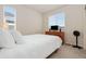 Cozy bedroom with natural light, neutral walls and carpet, creating a comfortable retreat at 9486 Juniper Way, Arvada, CO 80007