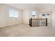 Bright bonus room or loft area with large windows, creating a versatile living space at 9486 Juniper Way, Arvada, CO 80007