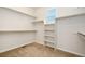 Spacious walk-in closet with shelving and ample hanging space, providing efficient organization and storage at 9486 Juniper Way, Arvada, CO 80007