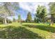 Expansive backyard with lush green grass and various play structures for outdoor fun at 4374 E Peakview Cir, Centennial, CO 80121