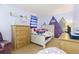 A light purple bedroom features natural-toned furniture and a mountain motif at 4374 E Peakview Cir, Centennial, CO 80121