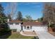 Charming two-story home with a well-maintained lawn, bay window and a driveway leading to a two-car garage at 4374 E Peakview Cir, Centennial, CO 80121