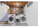 Clean laundry room with two newer machines and ample lighting at 4374 E Peakview Cir, Centennial, CO 80121