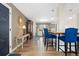 An open floorplan to the kitchen shows dining, living, and countertop seating at 4374 E Peakview Cir, Centennial, CO 80121