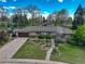 Aerial shot showcases the property's landscaped yard, sprawling layout, and peaceful neighborhood setting at 6544 E Alaska Dr, Denver, CO 80224