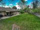 Large backyard, perfect for games, with covered porch perfect for gatherings, sits behind this charming brick home at 6544 E Alaska Dr, Denver, CO 80224