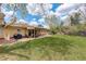 The property boasts a spacious yard with a covered patio, perfect for barbecues and outdoor entertaining at 6544 E Alaska Dr, Denver, CO 80224