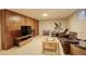 Spacious basement featuring a TV and an exercise bike at 6544 E Alaska Dr, Denver, CO 80224