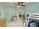 Comfortable bedroom features carpeted floors, bunkbeds, and a ceiling fan for air circulation at 6544 E Alaska Dr, Denver, CO 80224