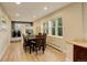 Bright dining room with hardwood floors, large windows, and elegant lighting, perfect for entertaining at 6544 E Alaska Dr, Denver, CO 80224