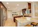 Gourmet kitchen featuring custom cabinetry, granite countertops, stainless steel appliances, and dual islands at 6544 E Alaska Dr, Denver, CO 80224