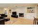 Cozy living room with fireplace and built-in bookshelves, creating a comfortable and inviting atmosphere at 6544 E Alaska Dr, Denver, CO 80224