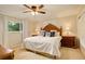 Comfortable bedroom with a ceiling fan, natural light, and coordinated decor at 6544 E Alaska Dr, Denver, CO 80224