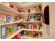 Well-organized pantry featuring ample shelving to maximize storage space and keep items neatly arranged at 6544 E Alaska Dr, Denver, CO 80224