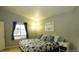 Cozy bedroom with hardwood floors and a large window with lots of light and view of the outdoors at 1354 Avgare Way, Erie, CO 80516