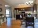 Bright kitchen boasting a center island, stainless steel appliances, and an adjacent dining area at 1354 Avgare Way, Erie, CO 80516