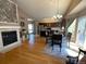 Open concept living room and eat-in kitchen with lots of natural light and wood-burning fireplace at 1354 Avgare Way, Erie, CO 80516