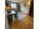 Functional home office features hardwood floors, a neutral color palette, and a desk with a comfortable chair at 1354 Avgare Way, Erie, CO 80516