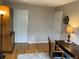 Home office with hardwood floors, neutral walls, and desk area with ample lighting at 1354 Avgare Way, Erie, CO 80516