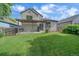 Spacious backyard featuring green grass, a pergola, and manicured shrubs at 5741 E 120Th Pl, Brighton, CO 80602