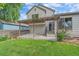 Backyard featuring a well-maintained lawn and pergola-covered patio at 5741 E 120Th Pl, Brighton, CO 80602