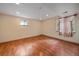 Finished basement features hardwood floors and two windows for natural light at 5741 E 120Th Pl, Brighton, CO 80602