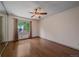 Spacious bedroom features a ceiling fan, hardwood floors, and a closet with mirrored doors at 5741 E 120Th Pl, Brighton, CO 80602