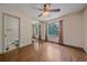 Comfortable bedroom boasts hardwood floors, ceiling fan, closet with mirrored doors and an ensuite bathroom at 5741 E 120Th Pl, Brighton, CO 80602