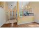 Modern kitchen featuring granite countertops and hardwood floors in adjacent living space at 5741 E 120Th Pl, Brighton, CO 80602