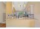 Granite countertops highlight this modern kitchen design in open floor plan at 5741 E 120Th Pl, Brighton, CO 80602