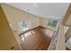 Bright living room features hardwood floors, a window seat, and large windows for lots of natural light at 5741 E 120Th Pl, Brighton, CO 80602