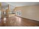 Sun-filled open concept area with a kitchen and living room with hardwood floors at 5741 E 120Th Pl, Brighton, CO 80602
