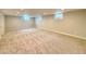 Expansive finished basement with recessed lighting and soft carpeting, great for entertaining at 2090 S Clinton St, Denver, CO 80231